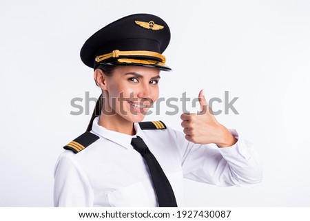 Photo of lovely lady raise thumb up beaming smile wear hat aviator uniform isolated white color background