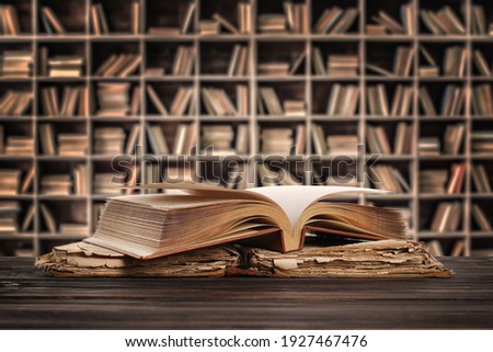 Old books on table in library Royalty-Free Stock Photo #1927467476