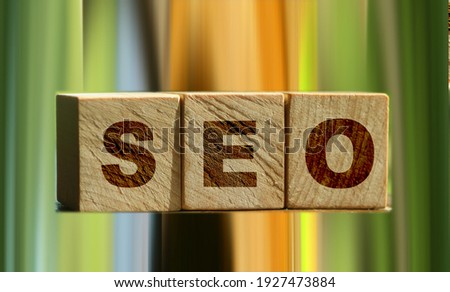 SEO - text on wooden cubes, on wooden background