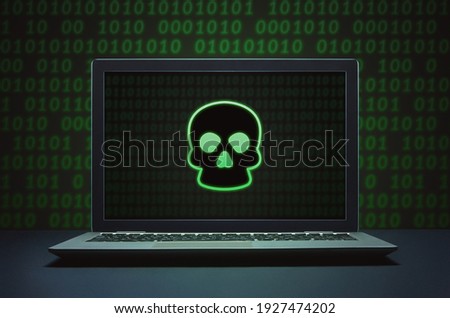 Dark hacking and malware concept on laptop computer screen.