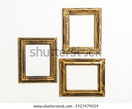 empty picture frame on white wall background with copy space Royalty-Free Stock Photo #1927479029