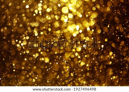 Vintage gold bokeh created by neon lights fwith black background