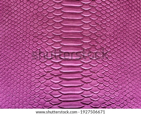Pink snake skin background, close-up texture picture