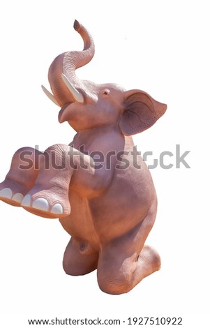 A statue of a baby elephant that crop out the black circle from the white.
