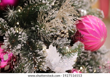 a Decorated Christmas tree on blurred background.