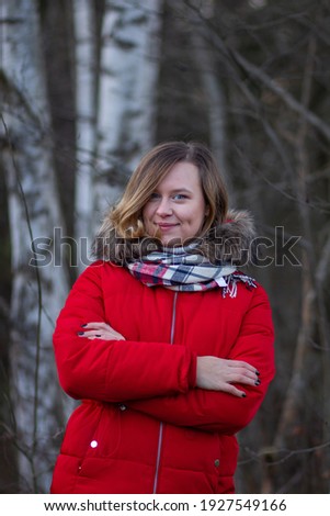 Young woman with red jacket Autumn scene