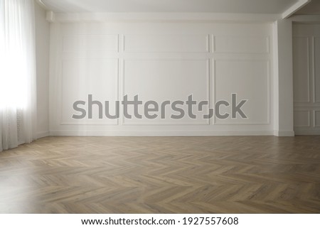 Parquet floor in light spacious empty room Royalty-Free Stock Photo #1927557608