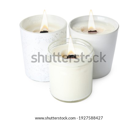 Aromatic candles with wooden wicks on white background
