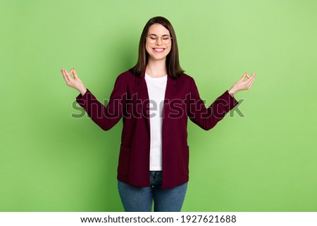 Photo of optimistic brown hairdo lady closed eyes wear spectacles red cardigan isolated on green color background