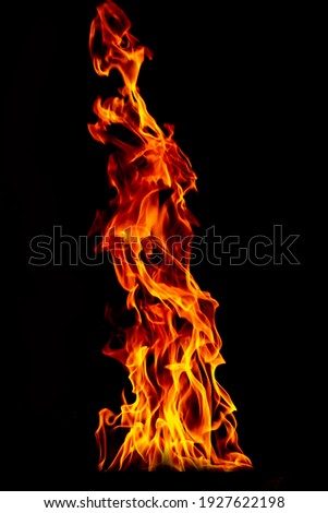 Fire flame isolated on black isolated background - Beautiful yellow, orange and red and red blaze fire flame texture style. Royalty-Free Stock Photo #1927622198