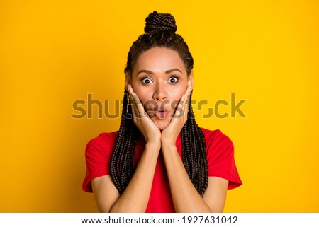 Portrait of charming amazed cheerful girl sudden news reaction pout lips isolated over bright yellow color background