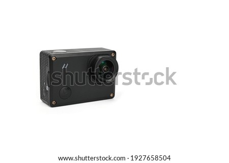 Action camera in the shape of a small black brick.