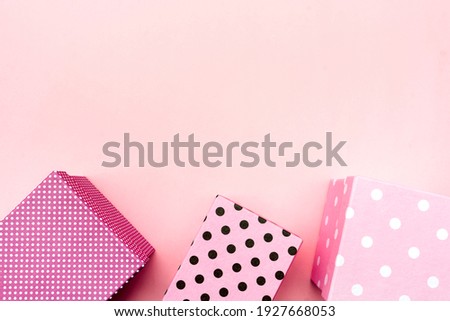 Gift boxs on paste pink background. Christmas and holiday minimal concept idea.