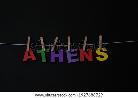 Word Athens on black background. Athens is the capital city of Greece. 