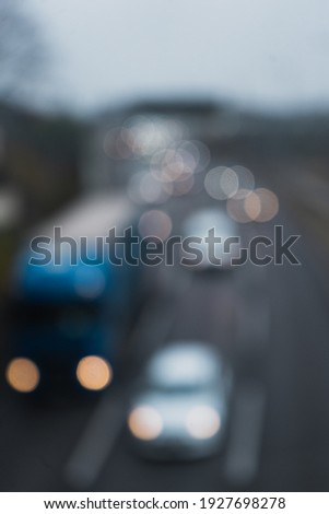 A blurred image of vehicles in traffic; bokeh effect lights