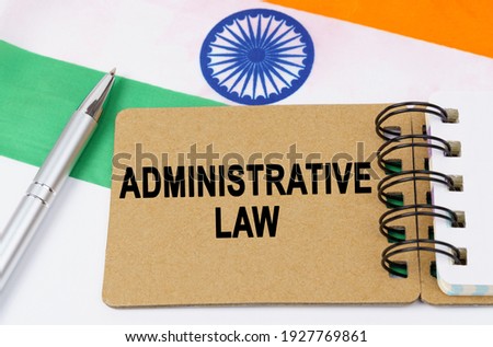 Law and justice concept. Against the background of the flag of India lies a notebook with the inscription - ADMINISTRATIVE LAW