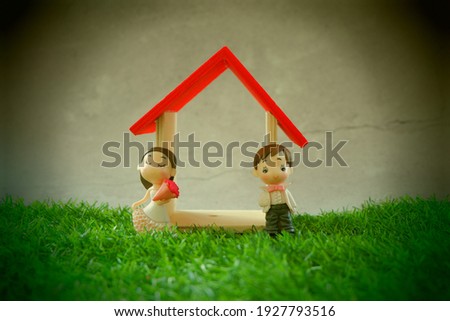 Wooden house with toys concept photo. 