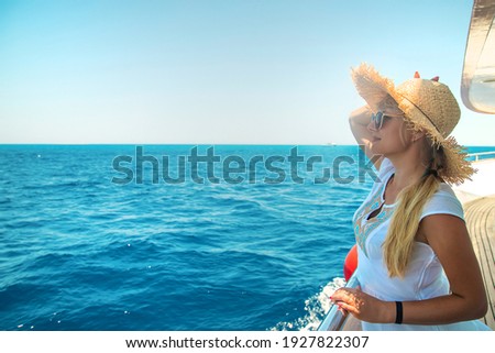 Woman in a hat at the sea. Selective focus. Girl.
