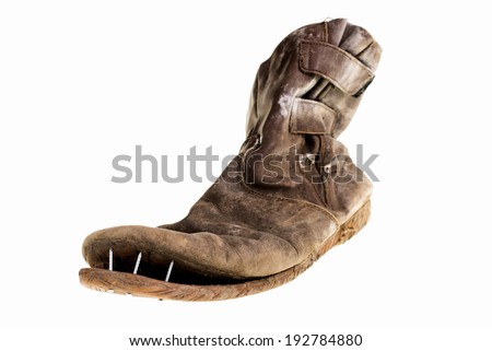 Dirty old boots isolated over white background