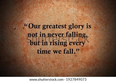 “Our greatest glory is not in never falling, but in rising every time we fall.”  Inspirational quote on vintage retro background. Ancient Chinese philosopher Confucius quote.
