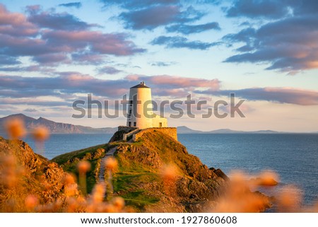 Lighthouse on Llanddwyn Island on the coast of Anglesey in North Wales,UK Royalty-Free Stock Photo #1927860608