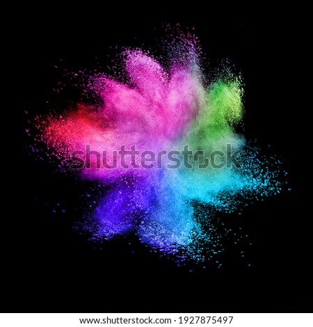 Decorative abstract chaotic colorful powder splash or explosion on a black background with copy space. Royalty-Free Stock Photo #1927875497