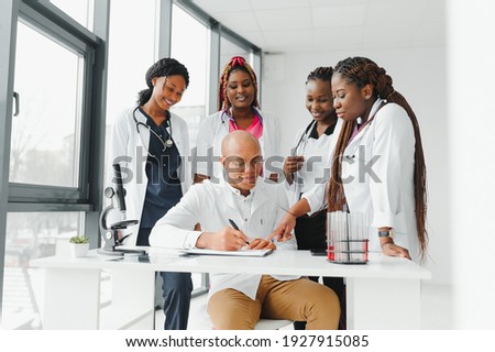 group of african american doctor and nurse in hospital ward