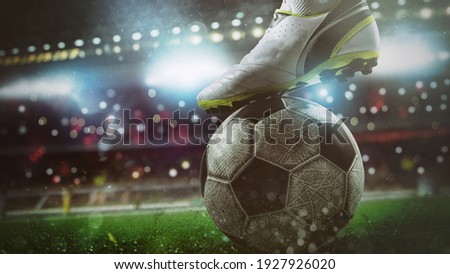 Close up of a soccer striker ready to kicks the ball at the stadium Royalty-Free Stock Photo #1927926020