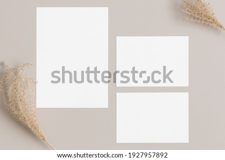 Wedding invitation stationery mockup with a dried grass decoration. Dimensions: 5x7", 3.5x5".