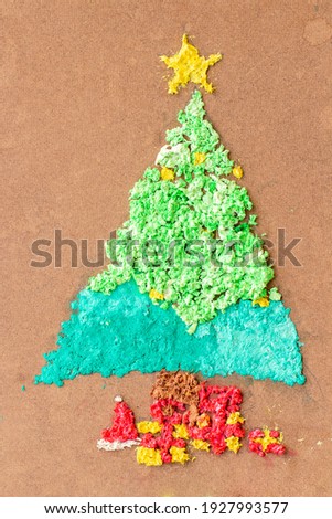 christmas tree, Gift boxon and star from paper on wooden background by children. create art for children. new year concept