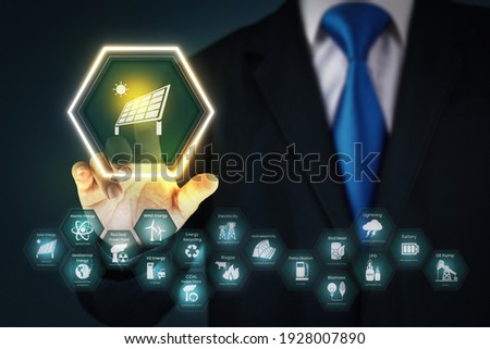 A man touches solar panel icon on a virtual screen.
businessman pressing button on virtual screens with hexagons and transparent honeycomb.
the concept of energy. Royalty-Free Stock Photo #1928007890