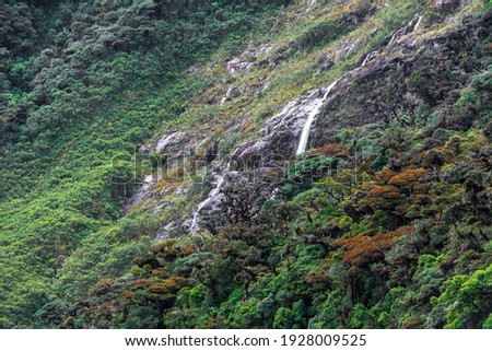 Beautiful waterfalls near the roads and mountains 