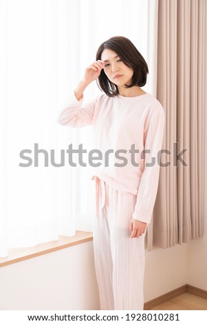 attractive asian woman in night clothes,fatigue