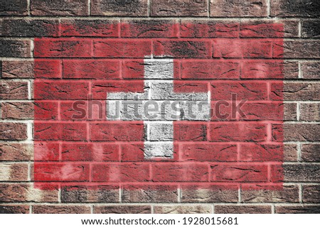 Switzerland flag on a brick wall background