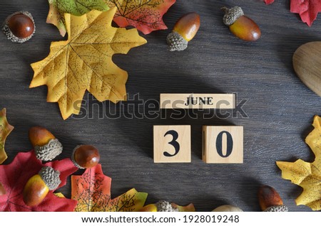 June 30, Cover Date design with Calendar cube decorate with maple leaf and Acorn Oak seed for your business.