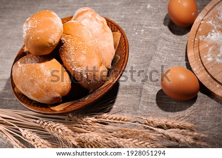 postcard with homemade pies on a burlap, wheat ears and chicken eggs