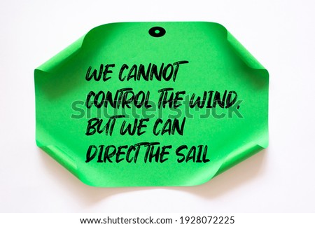 Inspirational motivational quote. We cannot control the wind, but we can direct the sail.