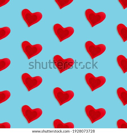 Love background made of red hearts on pastelle background