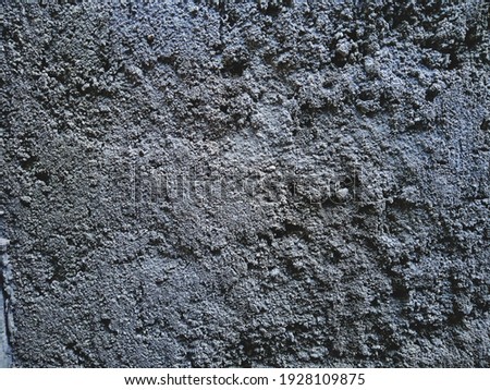 Textured background of gray cement wall