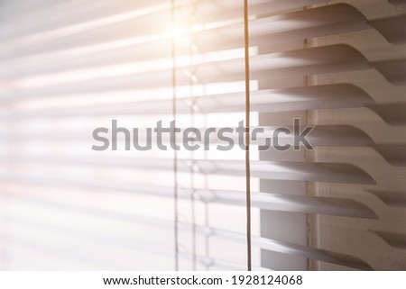 Blinds of sunlight come through the house. Royalty-Free Stock Photo #1928124068