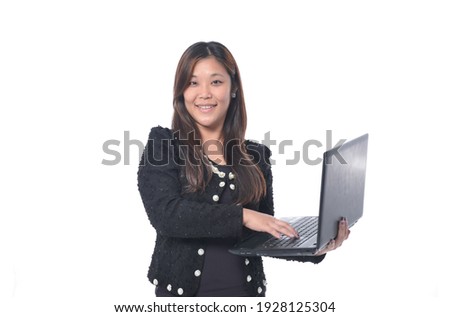 beautiful young smiling professional asian  business woman holding laptop,

 Royalty-Free Stock Photo #1928125304