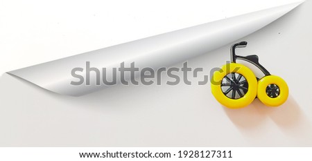 Yellow bicycle under a white background 