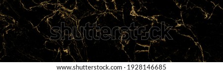 black golden stone texture with glossy surface.