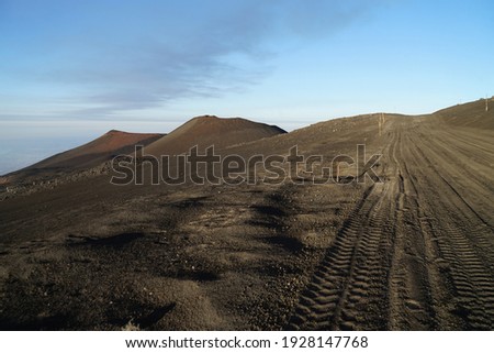 Mount Etna road for 4wd trucks and cars, Etna summit and crater trek hiking guided tour concept, Sicily, Italy