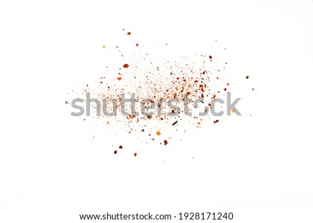 Hot Cayenne pepper. Pile crushed red cayenne pepper, dried chili flakes and seeds isolated on white background Royalty-Free Stock Photo #1928171240