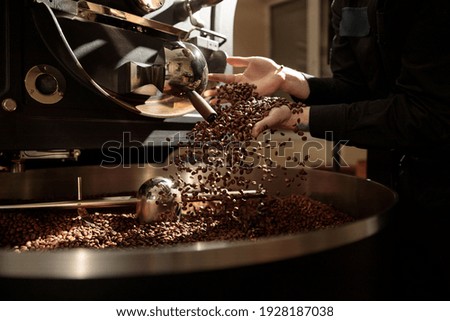 Professional handmade coffee roasting process  Royalty-Free Stock Photo #1928187038