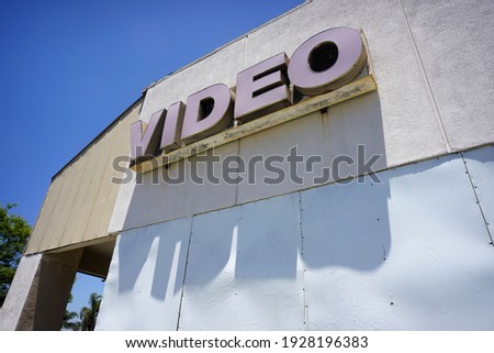  Aged and worn old video store sign                              