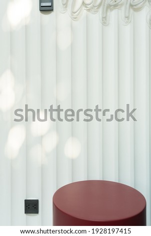 Empty red circular podium display on white wooden background with tree shadow red rectangle stand concept. Blank product shelf standing backdrop.