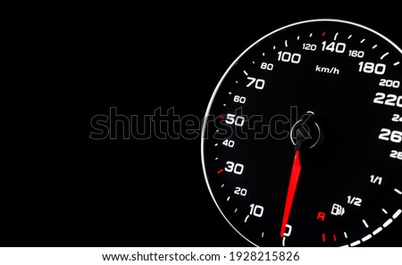 Close up shot of a speedometer in a car. Car dashboard. Dashboard details with indication lamps. Car instrument panel. Dashboard with speedometer, tachometer, odometer. Car detailing.
