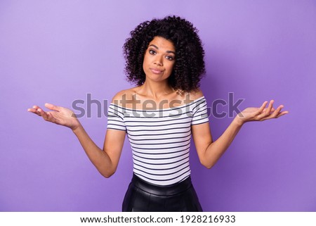 Portrait of pretty dark skin person raise hands palms shrug shoulder isolated on purple color background